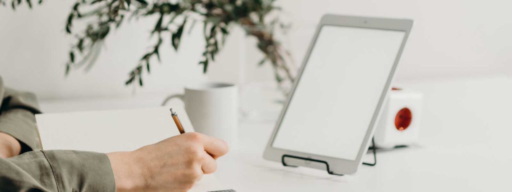 Writing notes at desk